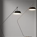 Modern Curved Floor Lamps With Black Shades Illuminated In Minimalist Space
