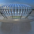 Contemporary Circular Glass Building With Geometric Design By Waterfront At Sunset