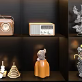 Modern Ornament Decor Combination With Various Sculptures Radios And Animal Figurines On Black Shelves With Lighting