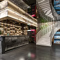 Modern Restaurant Interior Design With Spiral Staircase Green Plants Display Counters And Decorative Artworks