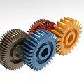 Three Different Colored Industrial Gears Used In Mechanical Equipment Systems
