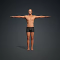 Man Standing Barefoot Shirtless in Black Shorts with Arms Outstretched Against Gray Background