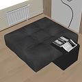 Black Leather Tufted Square Ottoman With Side Table And Magazines On Wooden Floor