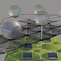 Sports Equipment Featuring Black Mesh Structure Over Green Turf With White Poles And Gray Seats