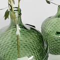 Green Textured Vases With Various Sizes Holding Green Foliage And White Small Flowers