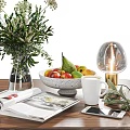 Fresh Mixed Fruits In Speckled Ceramic Bowl With Greenery Bouquet Glass Lamp Open Magazine And White Mug On Wooden Table