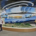 Cultural Center Interior With Visitors Exploring Exhibition Murals Digital Screens And Decorative Flags