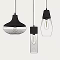 Three Modern Stylish Pendant Lights With Black Frames And Transparent Striped Shades