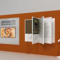 Art Installation Featuring Orange Display Wall Open Book Structure Colorful Painting Text Panels And Viewer