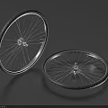 Two Bicycle Tires with Metal Rims and Spokes on Dark Blue Background