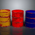 Three Colored Oil Drums Yellow Red Blue Rusty Metal Containers On Gray Background