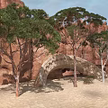 Green Trees In Rocky Mountain Landscape With Sandy Ground And Stone Arch Bridge