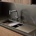Stainless Steel Kitchen Sink With Modern Faucet On Sleek Marble Countertop