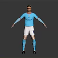 Male Football Player In Manchester City Jersey Number 10 White Shorts And Blue Socks