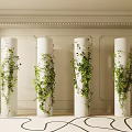 White Column Capitals Adorned With Green Vines In Light Walled Space With Carpet
