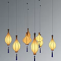 Elegant Teardrop Shaped Pendant Lights With Warm Yellow Glow And Blue Tassels Hanging