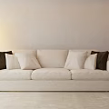 Cozy Beige Three Seater Sofa with Dark Cushions and Floor Lamp in Light Room
