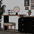 Stylish Dark Dresser with Round Mirror Drawers and Upholstered Stool Near Potted Plant