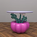 Coffee Table With Pink Pumpkin Shaped Base Green Curved Supports And White Round Top