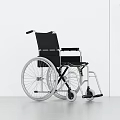 Modern Black Medical Wheelchair With Silver Wheels Armrests And Comfortable Seating
