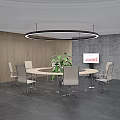 Modern Conference Room With Round Table Green Plant And Screen On Wooden Gray Walls