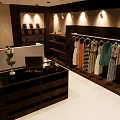 Elegant Wedding Dress Clothing Store With Pink Flowers And Mannequin