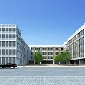 Modern School Buildings With Spacious Square Trees And Parking Lot Under Blue Sky