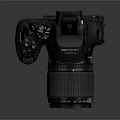 Fujifilm Black Camera Body With Pink Filter Lens On Reflective Surface
