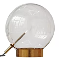 Modern Table Lamp With Transparent Spherical Lampshade Golden Base And Metal Pole