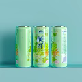 Three Attractive Light Green Beverage Cans With Decorative Floral Patterns And Labels