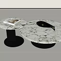 Round Marble Coffee Tables with Black Ribbed Base Featuring Green Cups Metal Tray and Magazine