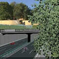 Multi Level Bridge with Roads and Vehicles Surrounded by Greenery Near Modern Buildings
