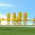 Industrial Equipment With Yellow Silos And Cranes On Concrete Paved Ground