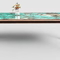Modern Dining Table With Green Brown Patterned Top And Vase Of Colorful Flowers
