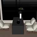Modern Minimalist Tea Table and Chairs With Black Wooden Top White Cushions and Indoor Plants