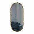 Ornate Gold Framed Oval Mirror Reflecting Blue Tufted Sofa And White Wall