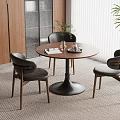 Cozy Dining Space Interior With Round Wooden Table Three Dark Chairs Wooden Cabinets And Window