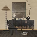 Artistic Entryway Console Table With Dark Distressed Texture Accent Chair Floor Lamp And Decorative Art