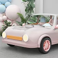 Pink Kids Toy Car Surrounded by Green Plants Balloons and Arch Decorations