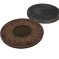 Copper Colored Circular Lid With Engraved Fortress Islands Patterns And Black Cover