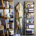 Modern Bathroom Accessories Display With Wooden Shelves Soft Towels Scented Candles And Potted Plant