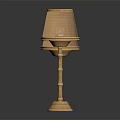 Two Gold Table Lamps With Mesh Shades Bamboo Poles And Textured Bases On Black Background