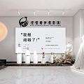 Elegant Bridal Shop Interior With Wedding Dresses On Mannequins And Floral Decorations