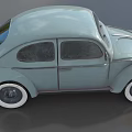 Light Blue Vintage Beetle Car With Curved Body And White Wall Tires