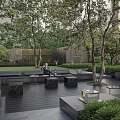 Modern Serene Residential Landscape With Lush Trees Seating Area And Art Sculpture
