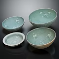 Elegant Celadon Glazed Tableware Set Featuring Four Bowls With Floral Patterns And Various Sizes