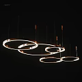 Modern Decorative Ring Shaped Illuminated Chandeliers Hanging On Black Background