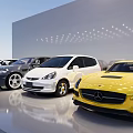 Various Cars in Different Colors and Styles Neatly Arranged in Modern Showroom With Lighting Effects