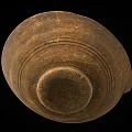 Ancient Pottery Bowl With Chipped Edges And Black Brown Textured Surface