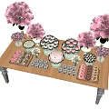 Colorful Dessert Table Arrangement With Pink Flowers And Assorted Sweet Treats